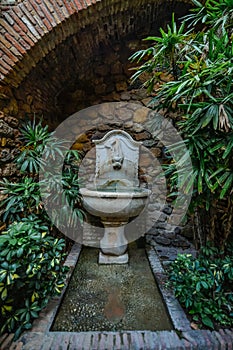 Patio with fountain and plants. Detail of the interior of the Alcazaba arab castle in Malaga