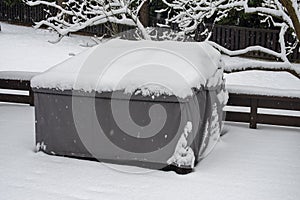 Patio furniture Cover protecting outdoor furniture from snow