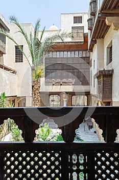 Patio of ottoman era Beit El Sehemy historic building framed by wooden balustrade, Cairo, Egypt photo