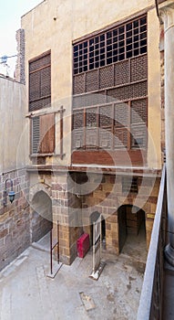 Patio of ottoman historic Waseela Hanem House with wooden oriel windows photo