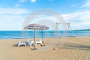 Patio outdoor table and chair on beach with sea beach background