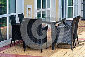 A patio table and chairs on a brick patio