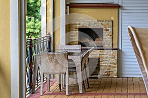 A patio with a table and chairs on a brick patio