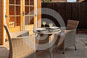 Patio table set for outdoor dining in sunshine