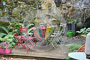 Patio with Wooden Deck and Colorful Chairs in Luxembourg