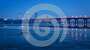 Paton bridge at night, across the Dnepr river. Kiev, Ukraine