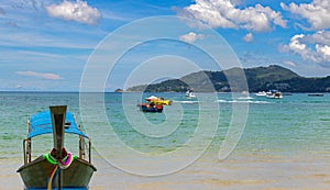 Patong Beach Phuket Thailand nice white sandy beach clear blue and turquoise waters and lovely blue skies