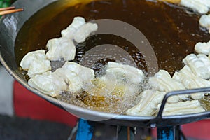 Patongko - Frying deep fried dough stick in pan