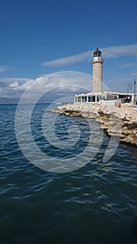 patra lighthouse greece ionio sea in sunny winter day photo