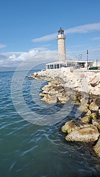 patra lighthouse greece ionio sea in sunny winter day photo