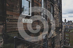 Patrick Gedges Steps and Grassmarket signages on a building wall in Old Town Edinburgh, Scotland, UK