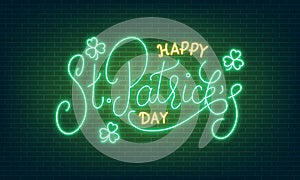 Patricks Day. Neon glowing lettering sign of Happy St. Patrick`s Day lettering and clover leaves