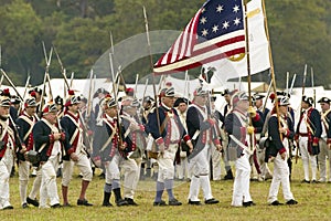 Patriot soldiers march to Surrender Field as part of the 225th Anniversary of the Victory at Yorktown, a reenactment of the siege