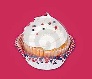 Patriotic 4th of July or Memorial Day cupcake on red background