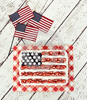 Patriotic American flag cake with mini flags