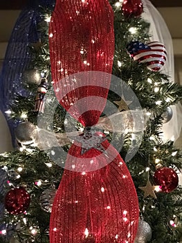 A patriotic Christmas tree covered in the stars & stripes