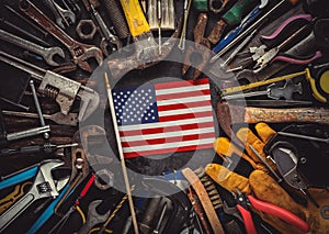 Patriotic collection of worn and used work tools with small US American flag. Made in USA, American workforce, or Labor Day