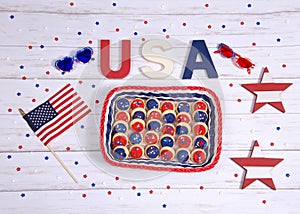 Patriotic cookies table setting on wood table, from above