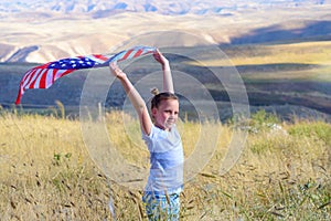 Patriotic holiday. Happy kid, cute little child girl with American flag. National 4 july. Memorial day.