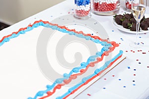 Patriotic red, white and blue cake with champagne