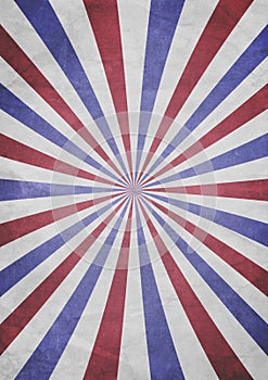 A patriotic red, white and blue sunburst effect grunge textured background with aged paper effect
