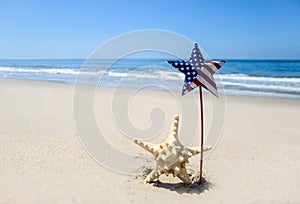 Patriotic USA background with starfish on the sandy beach