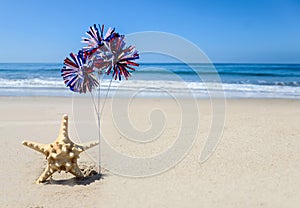 Patriotic USA background with starfish on the sandy beach