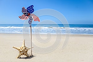 Patriotic USA background with starfish on the sandy beach