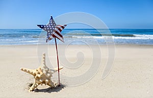 Patriotic USA background with starfish on the sandy beach