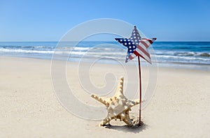 Patriotic USA background with starfish on the sandy beach