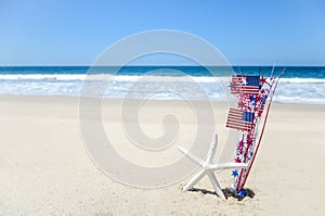 Patriotic USA background with starfish on the sandy beach