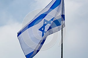 Patriotism in Israel. A row of flags of Israel in front of the Israeli parliament Knesset. Israeli flags against the sky. Israel I