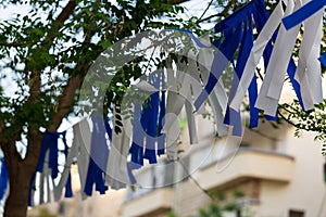 Patriotism in Israel. A row of flags of Israel in front of the Israeli parliament Knesset. Israeli flags against the sky. Israel I
