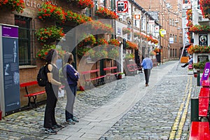 Patrons outside the historic Duke of York pub in Commercial Lane in Belfast, Northern Ireland.