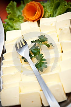 Pats of butter with fork