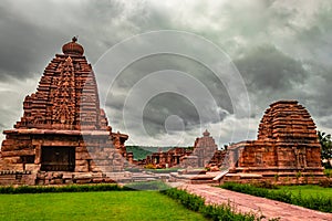 Pattadakal temple complex group of monuments breathtaking stone art with dramatic sky photo
