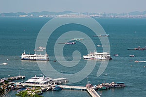 Pattaya city and many boats and ferry in the sea