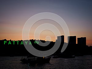 Pattaya city sign with silhouette background on sunset in pattaya thailand