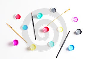 pattern of acrylic paint in cans and brushes.