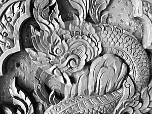Pattern art processing of sculpture image carvings on wood background. Thai style carved wooden door detail, Close up,black