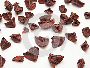 Pattern background of a Indian betelnut slices isolated on a white background