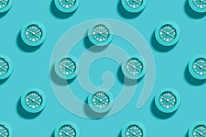 Pattern of blue alarms on light blue background