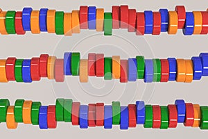 Pattern of blue, red and green cylinder tablets on white background