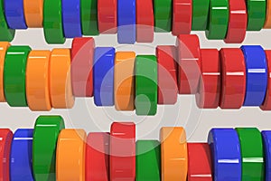 Pattern of blue, red and green cylinder tablets on white background