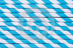 Pattern of blue striped paper straws.