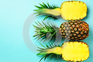 Pattern with bright pineapples on blue background. Top View. Copy Space. Minimal style. Pop art design, creative summer