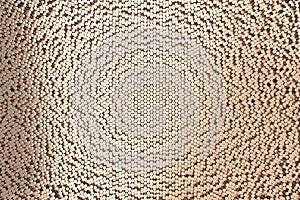 Pattern of brushed copper cylinders of different length