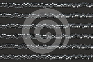 Pattern of brushed metal cylinder tablets on black background