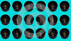 Pattern with camera lenses on a blue background