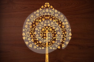 Pattern carve gold tree on wood texture